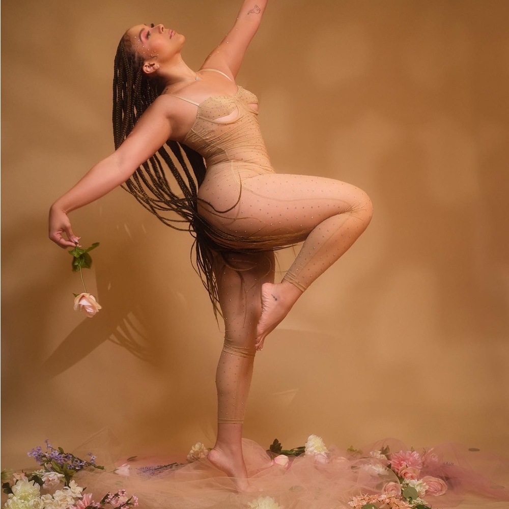 Beautiful sparkled see through nude jumpsuit. Size M.